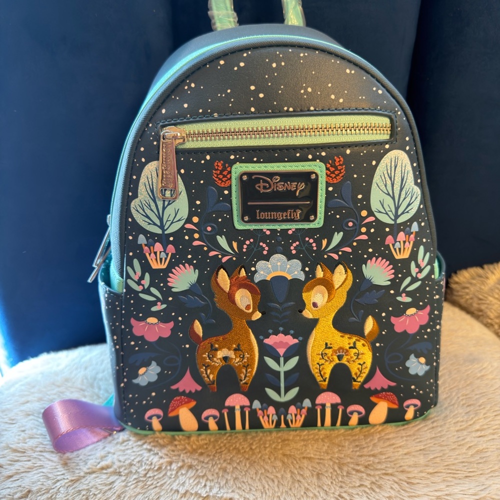 Loungefly Disney Bambi Folk Floral Green
Mini Backpack and wallet set. - Picture 2 of 7